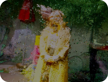 A Blurred figure seen through a rain-spattered window